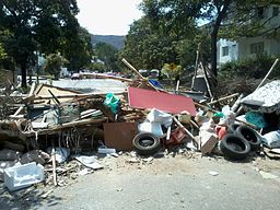 A barricade built by protesters blocking a street [Public Domain]