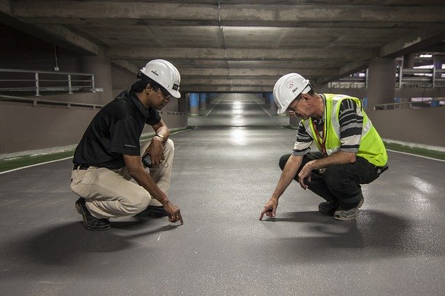 Two men inspecting work