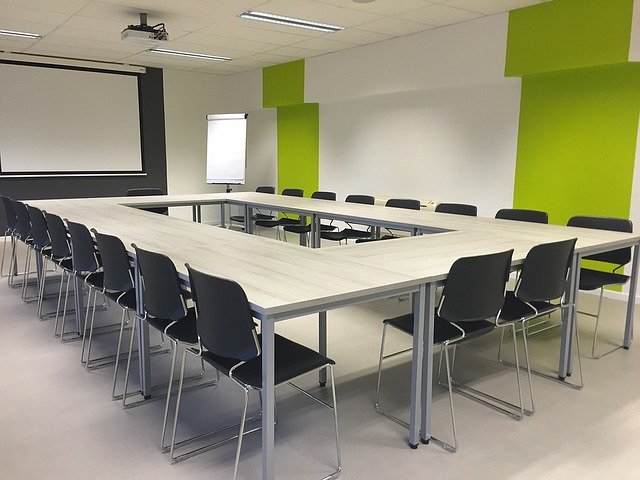Classroom via https://pixabay.com/photos/meeting-modern-room-conference-1177454/